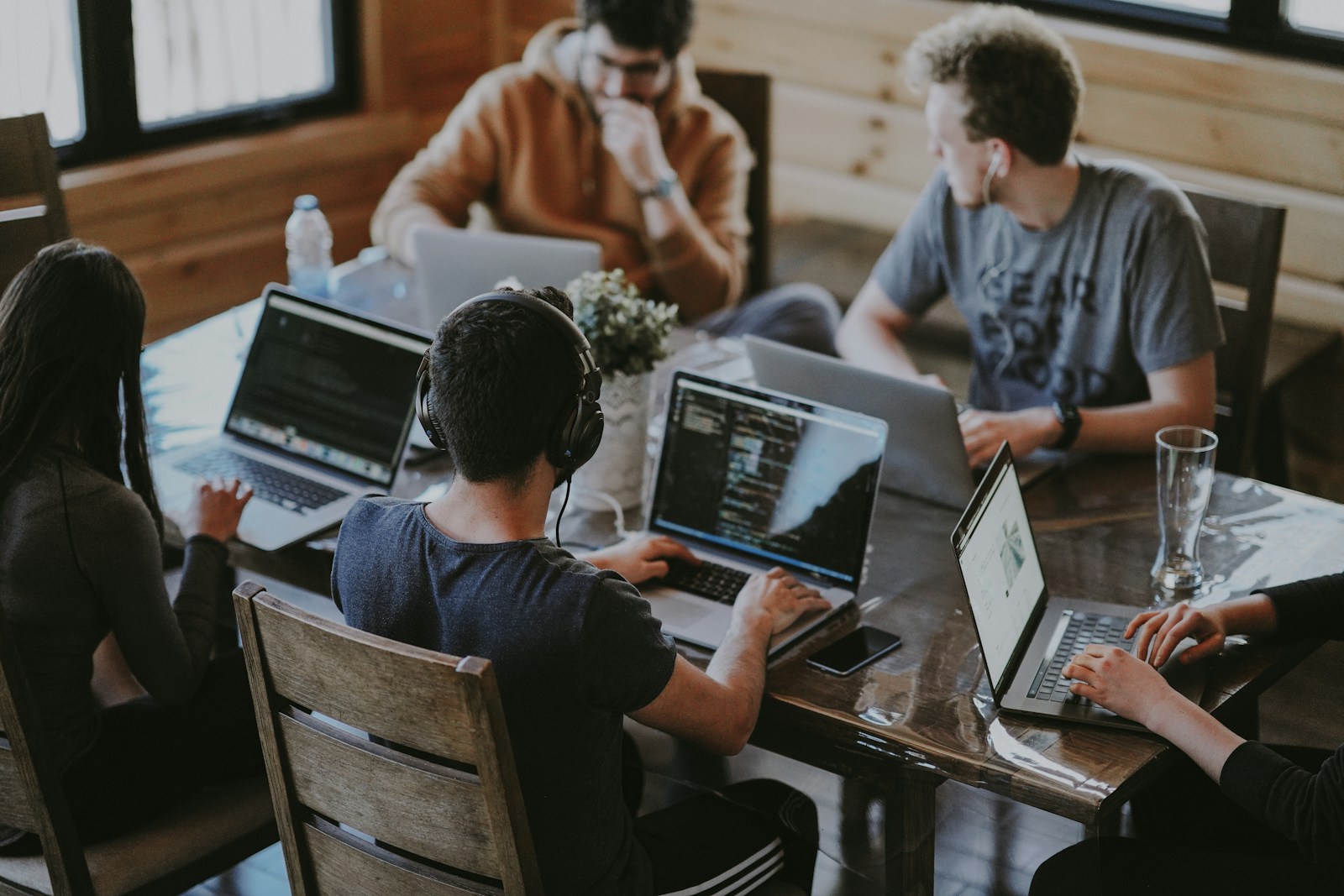 group of people using laptop computer business